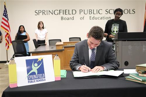 Teacher leader signing