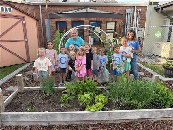  Students help harvest the Shady Dell Early Childhood Center garden.