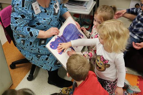 students touching book 