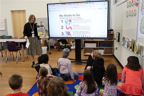 teacher holding kit