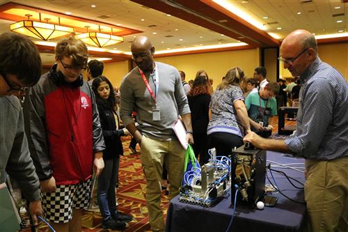 Students engage with booth 